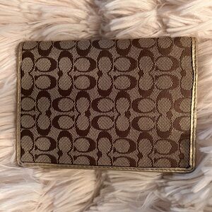 Coach Brown and gold signature passport case. In excellent condition.